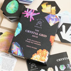 The Crystal Grid Deck box by Grace Doong from The Mindful Muse, displayed on a light beige surface surrounded by its cards and crystal-themed accessories.