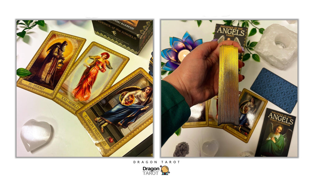 Dragon Tarot card deck set displayed with several illustrated cards laid out on a white surface and a hand holding a gold-edged deck box or card stack. The scene includes decorative crystals, flowers, and branded packaging, with the Dragon Tarot name visible at the top and bottom.
