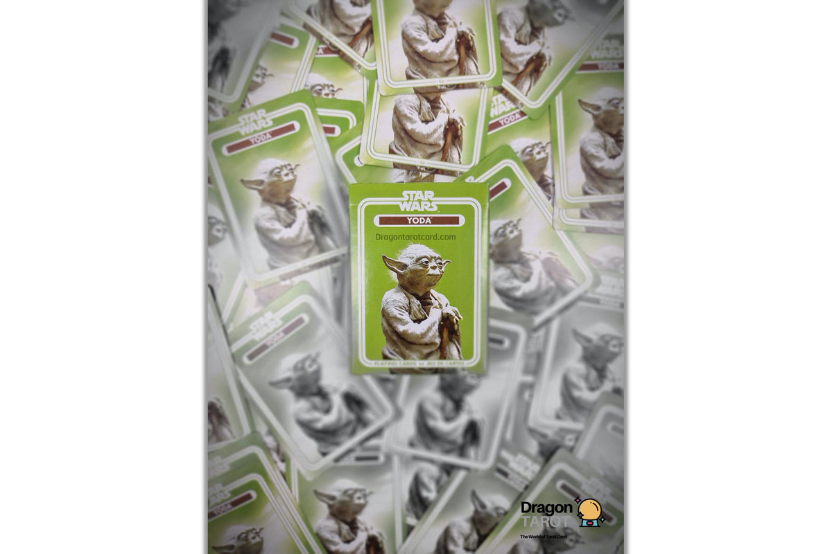 A Star Wars Yoda collectible card is centered over a scattered pile of matching cards, with a Dragonfly logo watermark in the bottom right corner.