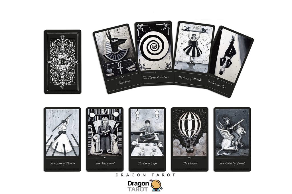 A set of tarot cards displayed on a white background, featuring both the back of a card with ornate black-and-white patterns and several front cards with black-and-white illustrations and Thai text. Dragon Tarot branding is visible at the top and bottom.