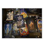A set of illustrated tarot cards spread out on a dark surface, featuring mystical and celestial artwork in blue, gold, red, and black tones.