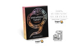 Dragon Tarot card deck box shown on a white background with promotional text and logos. The box is black with a pink top edge and a stylized dragon illustration in metallic-looking tones.