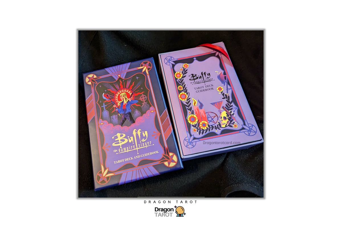 Two boxed tarot card decks, one titled 'Buffy the Vampire Slayer' and the other 'Stefania' with floral and dragon artwork, displayed on a black fabric background.
