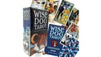 Wise Dog Tarot deck with its box, guidebook, and several illustrated cards fanned out behind it on a plain white background.