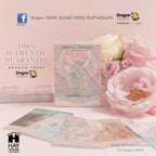 A boxed tarot card deck labeled 'All Rose' with several cards spread out in front, styled with pink and white roses on a pale pink background. Branding for Dragon Tarot and Hay House is visible.