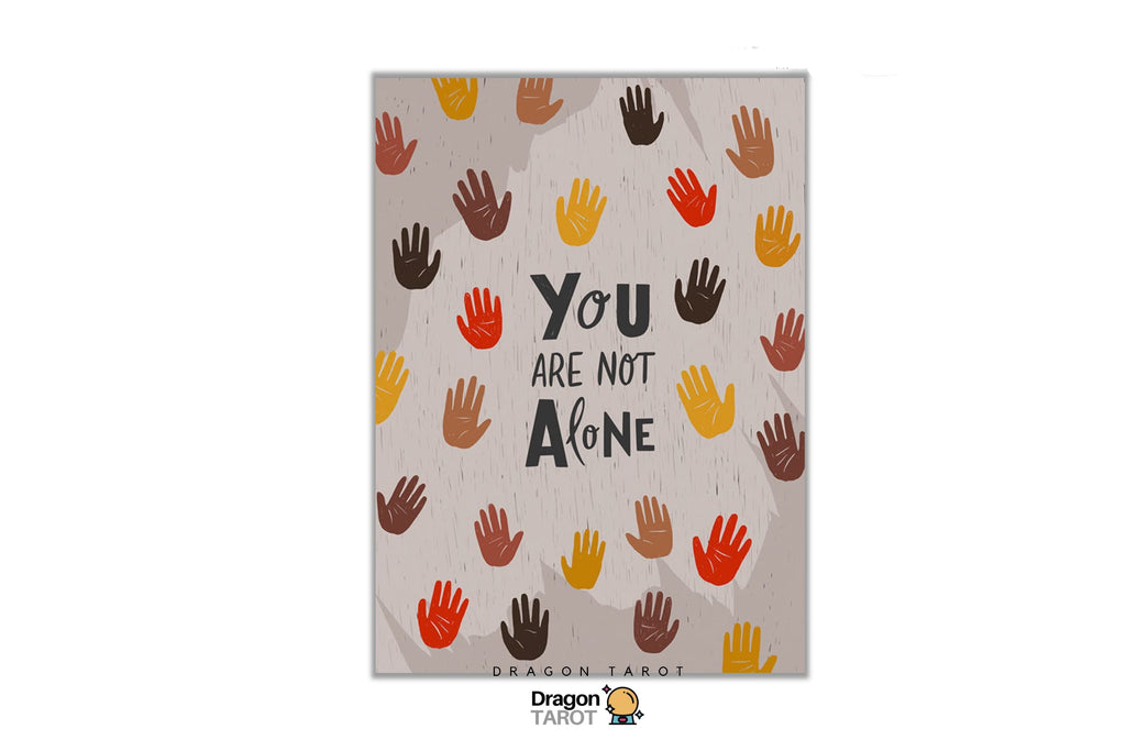 A Dragon Tarot art print featuring the quote 'YOU ARE NOT ALONE' in black text surrounded by colorful handprints in orange, yellow, brown, and red on a textured beige background. The print is centered on a white canvas with Dragon Tarot branding at the top and bottom.