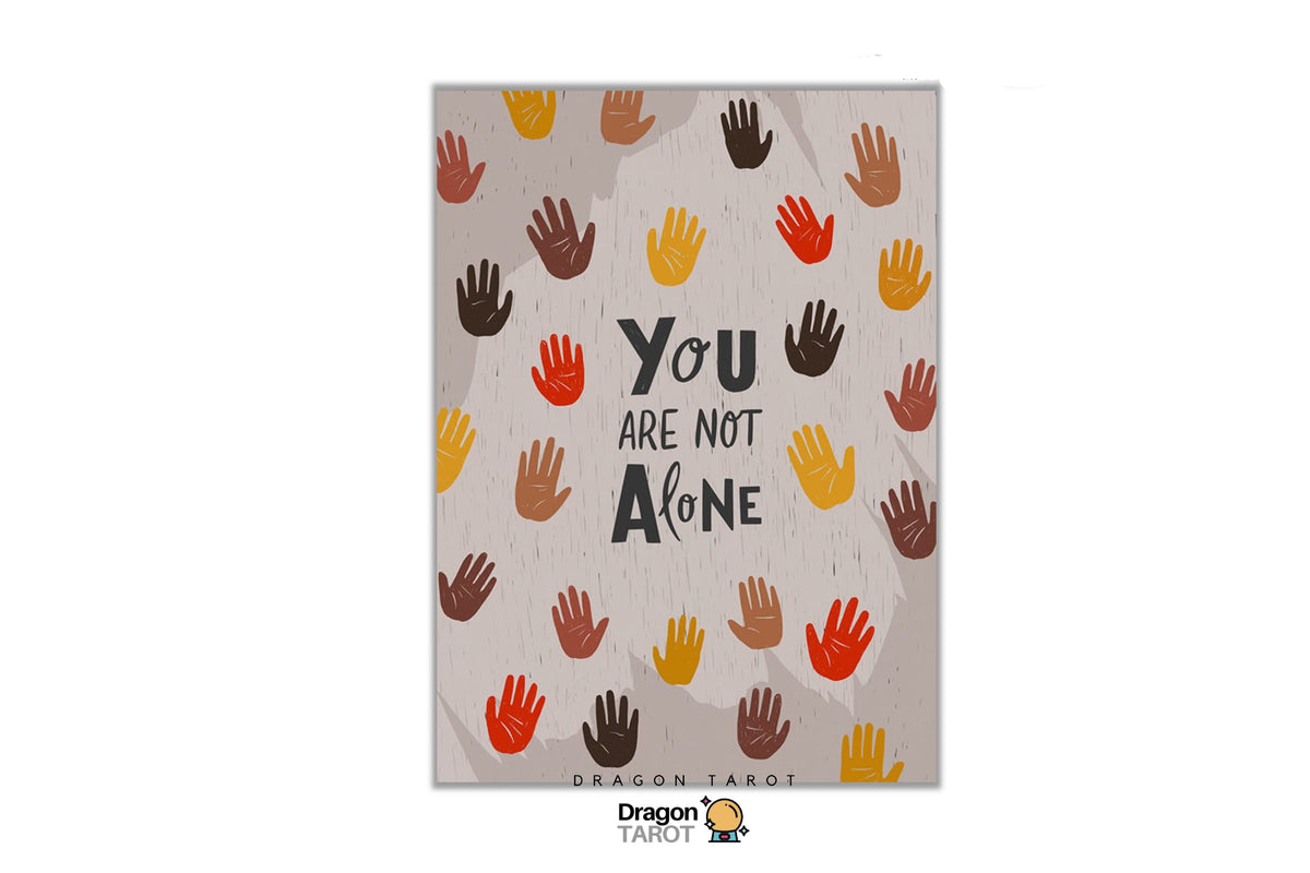 A Dragon Tarot art print featuring the quote 'YOU ARE NOT ALONE' in black text surrounded by colorful handprints in orange, yellow, brown, and red on a textured beige background. The print is centered on a white canvas with Dragon Tarot branding at the top and bottom.