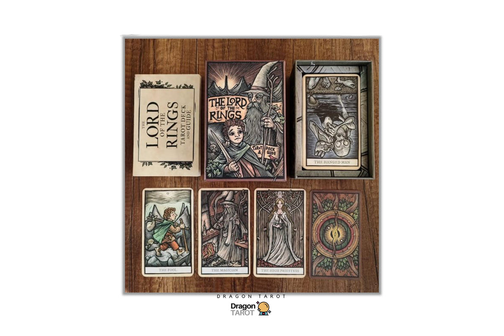 Dragon Tarot Lord of the Rings tarot deck displayed on a wooden background, showing the box, booklet, and several illustrated cards with fantasy artwork.