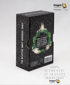 The Mutually Assured Goddess Tarot deck box by Dragon Tarot, featuring a black glittery exterior with a circular green and white illustration of a winged goddess figure on the front.