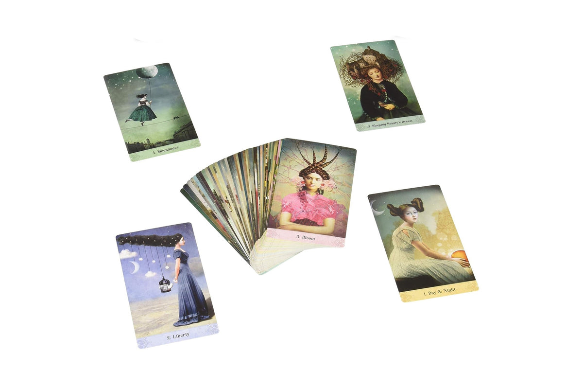 A set of Dragon Tarot oracle cards displayed on a white background, including a fanned deck and four individual cards showing different illustrated scenes.