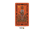 A tarot card featuring a skeleton standing among candles under a jack-o'-lantern moon, with the Spanish title 'Reino de Pentacos' on an orange background. The card is centered on a white background with the Dragon Tarot logo below.