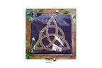 A dark purple tarot card wrapped in clear plastic, featuring a gold Celtic triquetra symbol, displayed on a wooden surface with green leaves around it. A white banner at the top and bottom displays the brand 'Dragon TAROT' with Thai text.