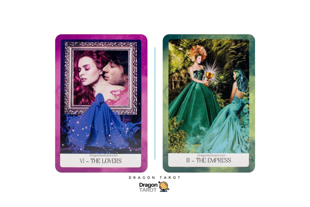 Two tarot cards from the Dragon Tarot deck displayed side-by-side on a white background. The left card is 'VI - THE LOVERS' with a purple border and an illustration of two women embracing in front of a mirror.