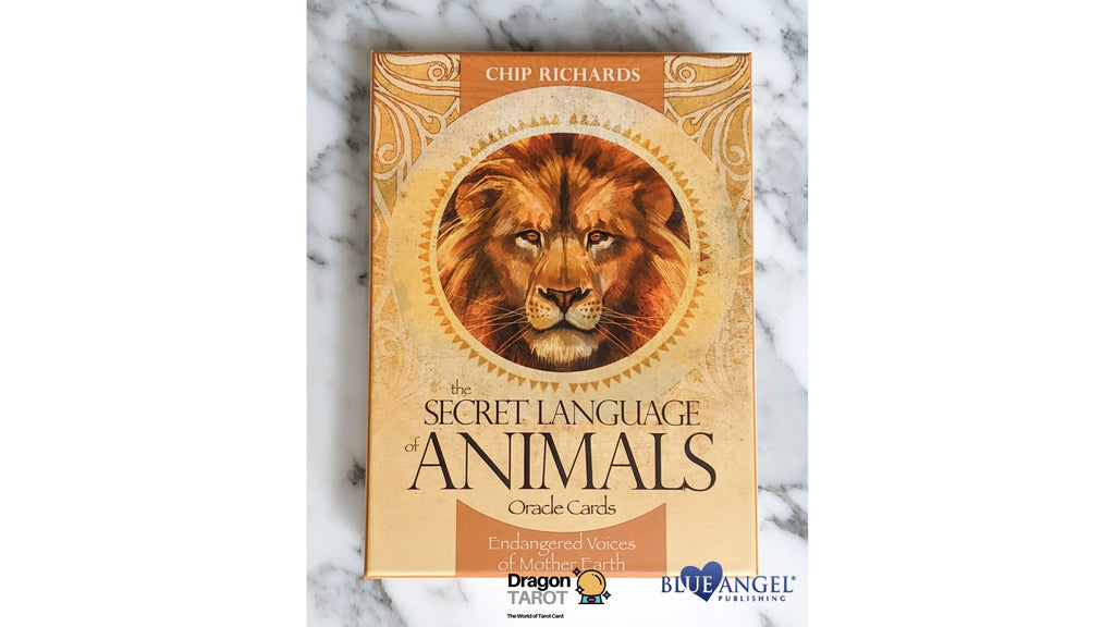 The Secret Language of Animals Oracle Cards box by Chip Richards, featuring a golden lion illustration on a marble background.
