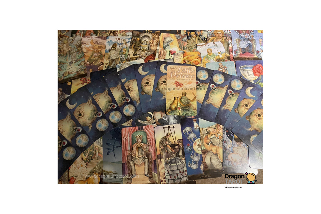 A collection of tarot cards and oracle cards fanned out, featuring mystical illustrations of moons, wolves, and fantasy characters on a white background.