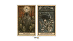 Two illustrated tarot card designs shown side by side on a white background: 'The Devil' on the left with a hooded figure and surrounding skulls, and 'The Hanged Man' on the right with a hanging skeleton-like figure. The cards have a vintage parchment look with black and muted orange-brown linework.