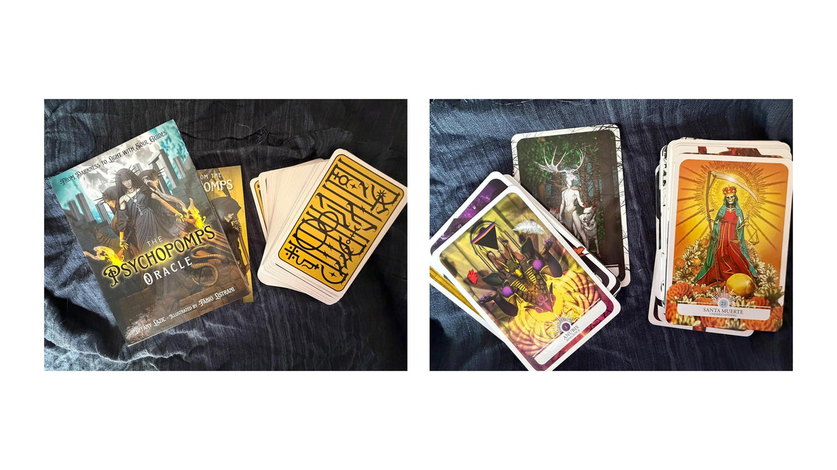 Two tarot card decks and several illustrated cards displayed on dark fabric. The left deck box reads 'Psychic Roma Oracle' and the right deck box reads 'The Oracle'.