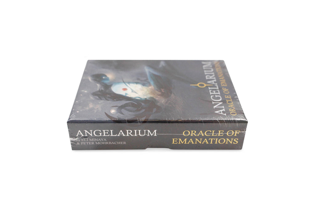 The box of the 'Angelarium: Oracle of Emanations' tarot deck, featuring dark artwork of a winged figure on a black background with gold lettering. The image is set against a plain white background with social media and distributor logos at the top.