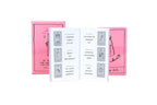 A white booklet or card set displayed open in front of two pink illustrated boxes on a plain white background.