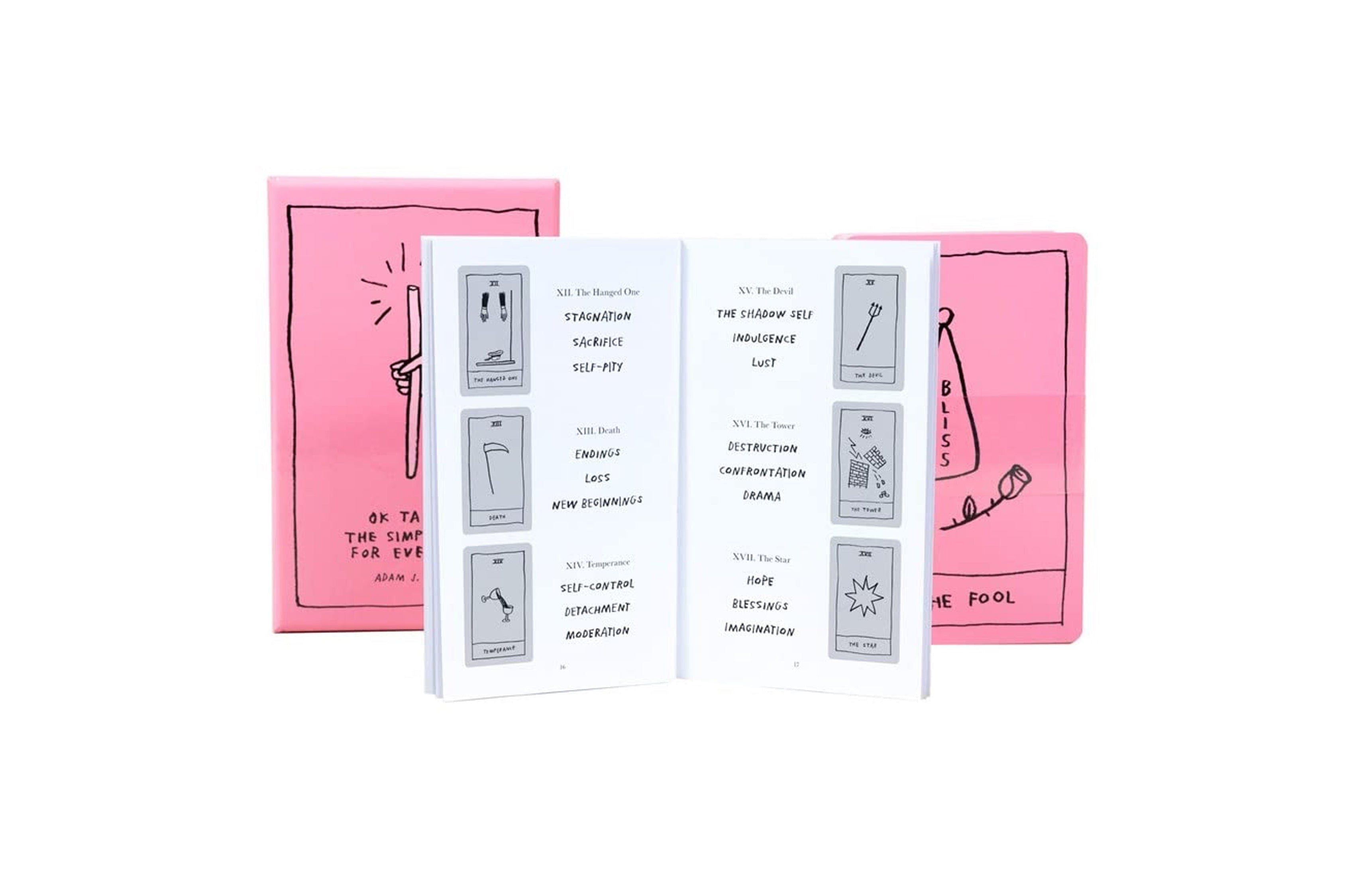 A white booklet or card set displayed open in front of two pink illustrated boxes on a plain white background.