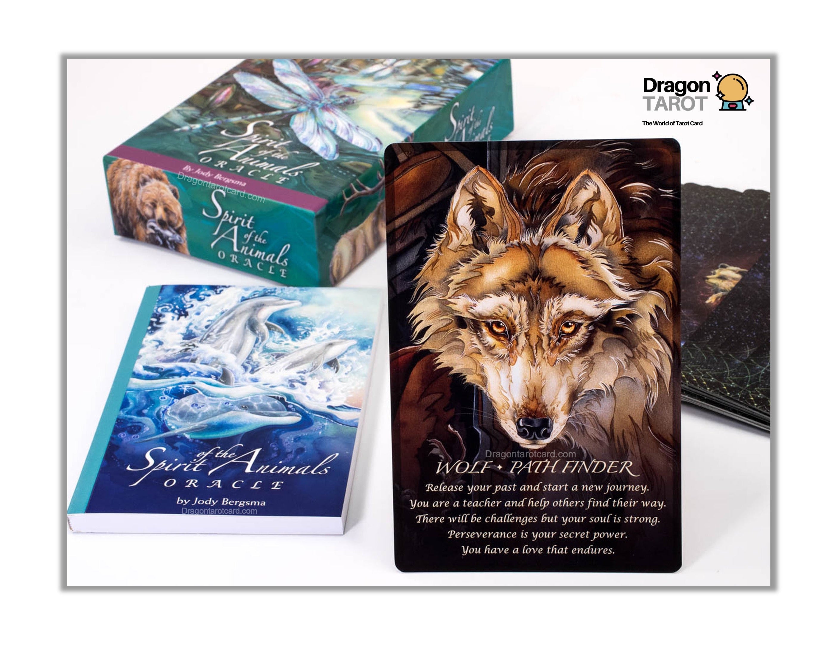 A boxed tarot deck set shown on a white background, featuring a wolf card in front, a blue water-themed card beside it, and the green box behind. The top right corner includes a Dragon Twist logo.