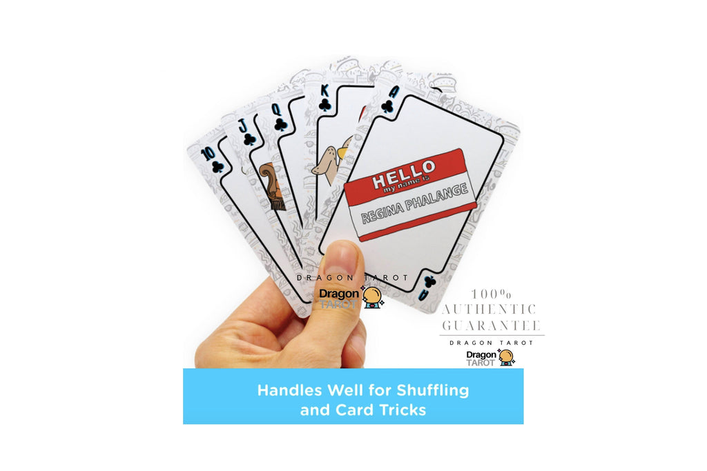 A hand holds a fan of Dragon Tarot playing cards against a white background, with product text and branding visible. The cards have a silver border and a red-and-white 'HELLO' card in the center.