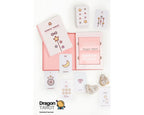 Kawah Tarot card deck set displayed on a white background, including the pink and white box, an illustrated card, a moon card, crystals, and the Dragon Tarot logo at the bottom.