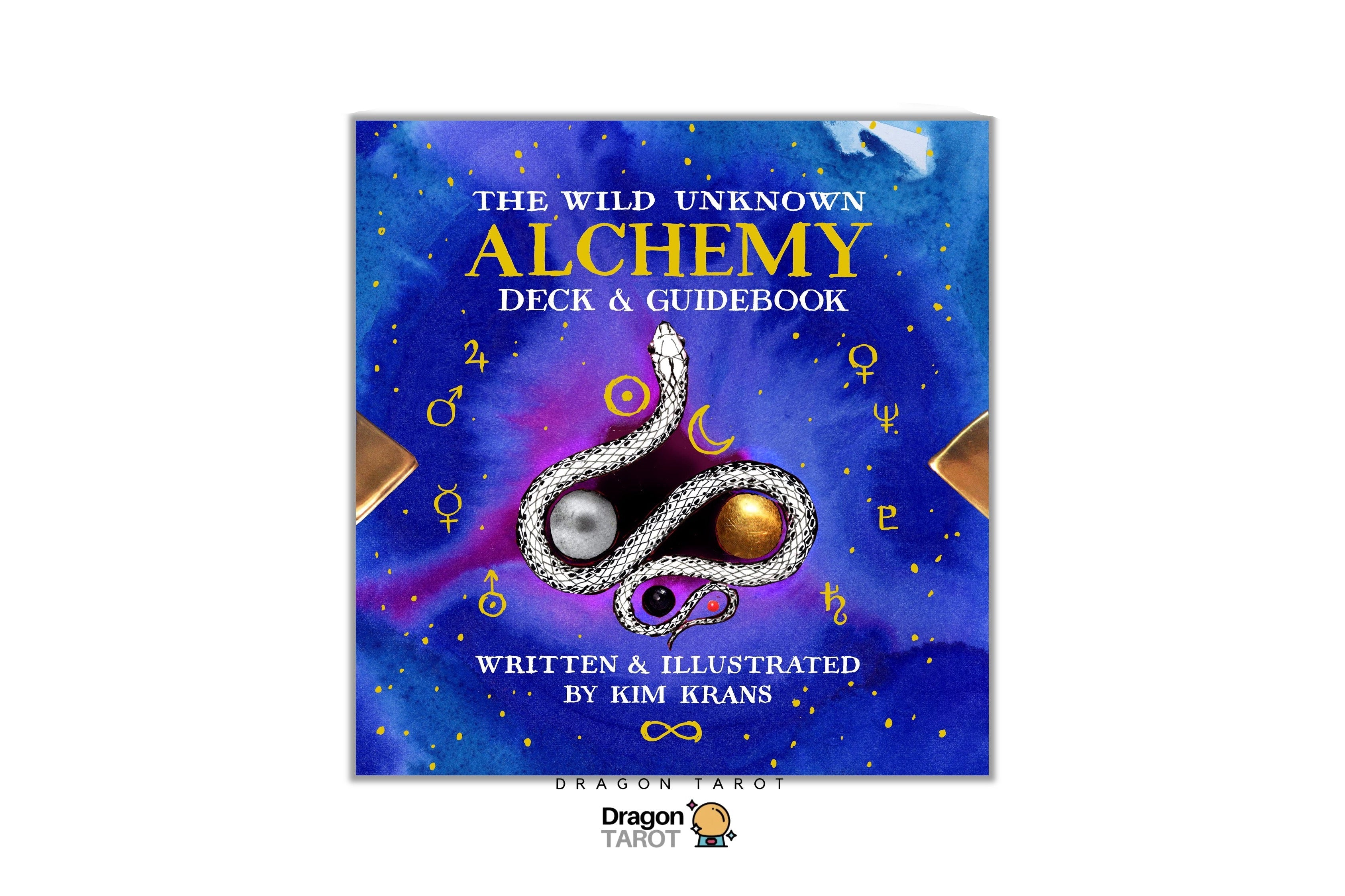 The Wild Unknown Alchemy Deck & Guidebook by Kim Kraus, featuring a cosmic blue cover with a silver and gold serpent illustration and astrological symbols.