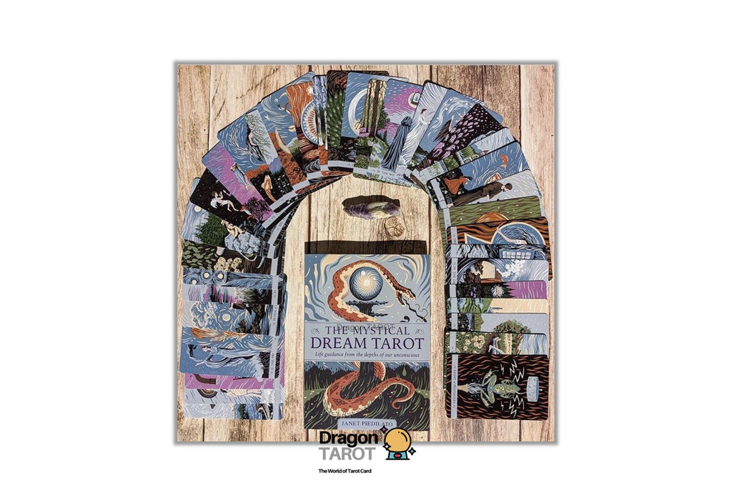 The Mystical Dream Tarot deck box shown upright on a light wood background, with an arch of illustrated tarot cards fanning out behind it. The box features fantasy artwork with a snake and the title 'THE MYSTICAL DREAM TAROT.