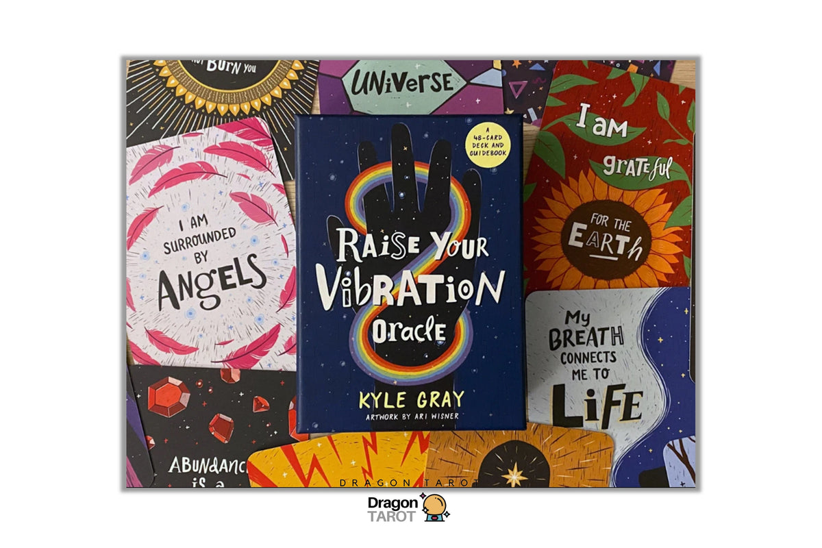 A collage of colorful tarot card decks and cards displayed on a white background with a Dragon Tarot logo at the bottom. Visible titles include 'Raise Your Vibration Oracle' by Kyle Gray, 'I Am Grateful For The Earth', 'I Am Surrounded By Angels', and 'My Breath Connects Me To Life'.