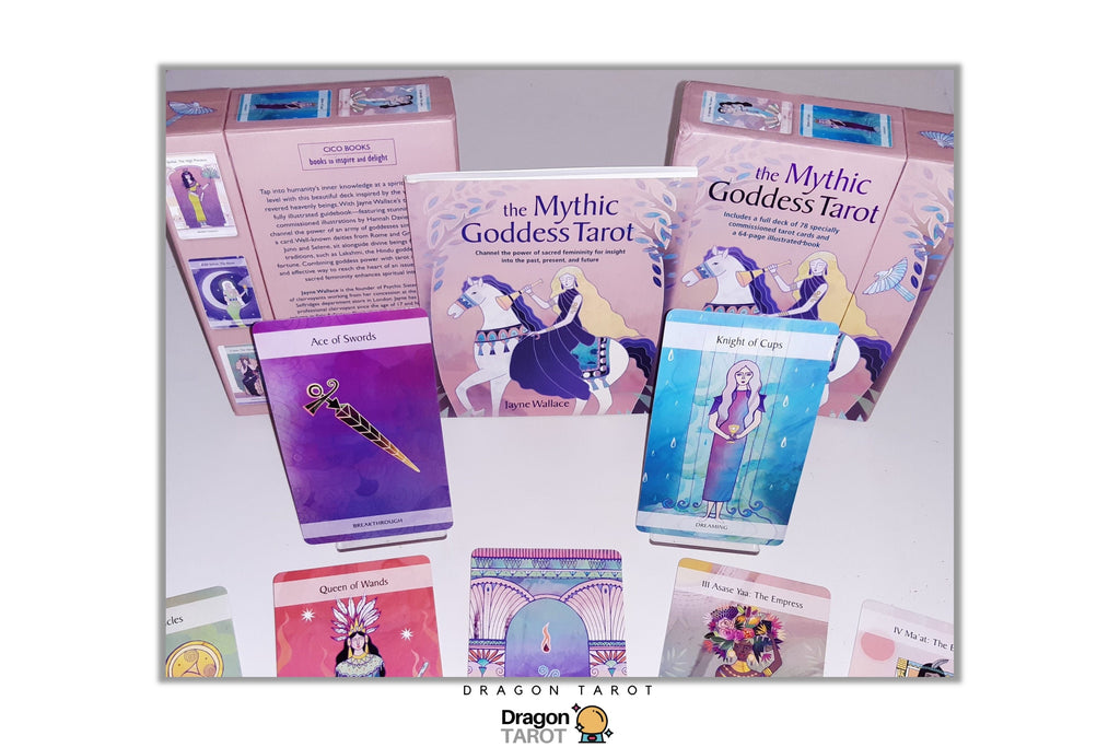 The Mythic Goddess Tarot deck displayed with its pink outer box, an illustrated card back, a purple 'Art of Swords' card, a blue 'Knight of Cups' card, and several other tarot cards fanned out below on a white background.