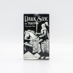 A deck of tarot cards in a black and white illustrated box featuring the title 'Dark Side of Tarot' and an illustration of a knight on a horse, shown against a plain light gray background.