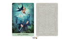 King of Swords tarot card shown upright alongside its ornate back design on a white background. The card features a stylized figure in blue-green robes with a sword hilt and a black bird above, with the text 'KING of SWORDS' at the bottom.