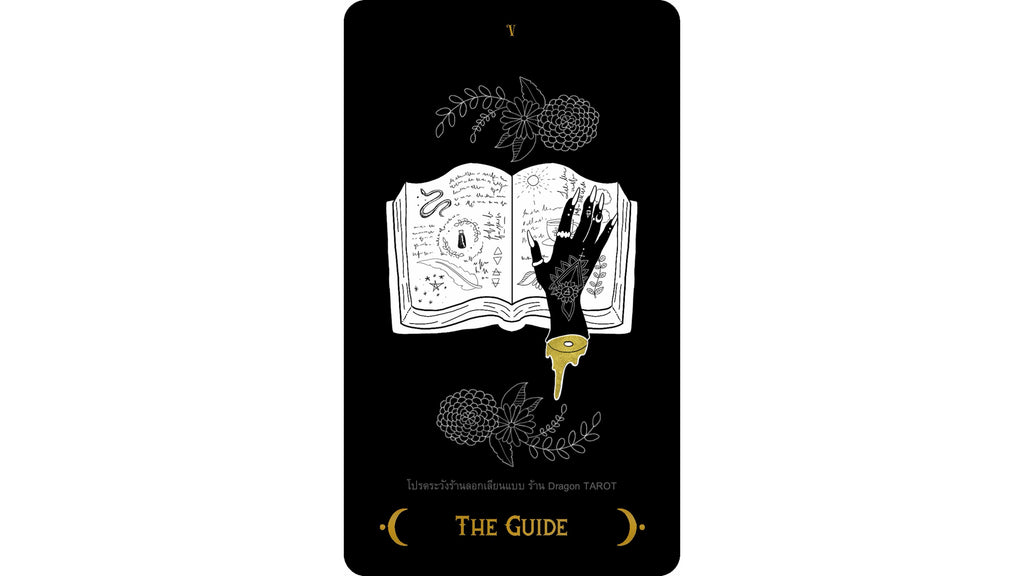 A tarot card titled 'THE GUIDE' from 'Lines of Fate' by The Dragon Tarot, featuring a black background with white line art of an open book, a hand, and botanical illustrations, accented with gold text and a gold key.