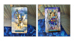 Two illustrated tarot-style cards shown side by side on a decorative blue and gold background. The left card depicts a winged sword with the text 'Ace of Swords,' and the right card depicts a throne figure with the text 'King of Swords.