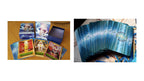 A tarot card deck set displayed on a wooden surface, showing the blue illustrated outer box, an open inner box, several cards with fantasy artwork, and a fanned stack of blue-backed cards.
