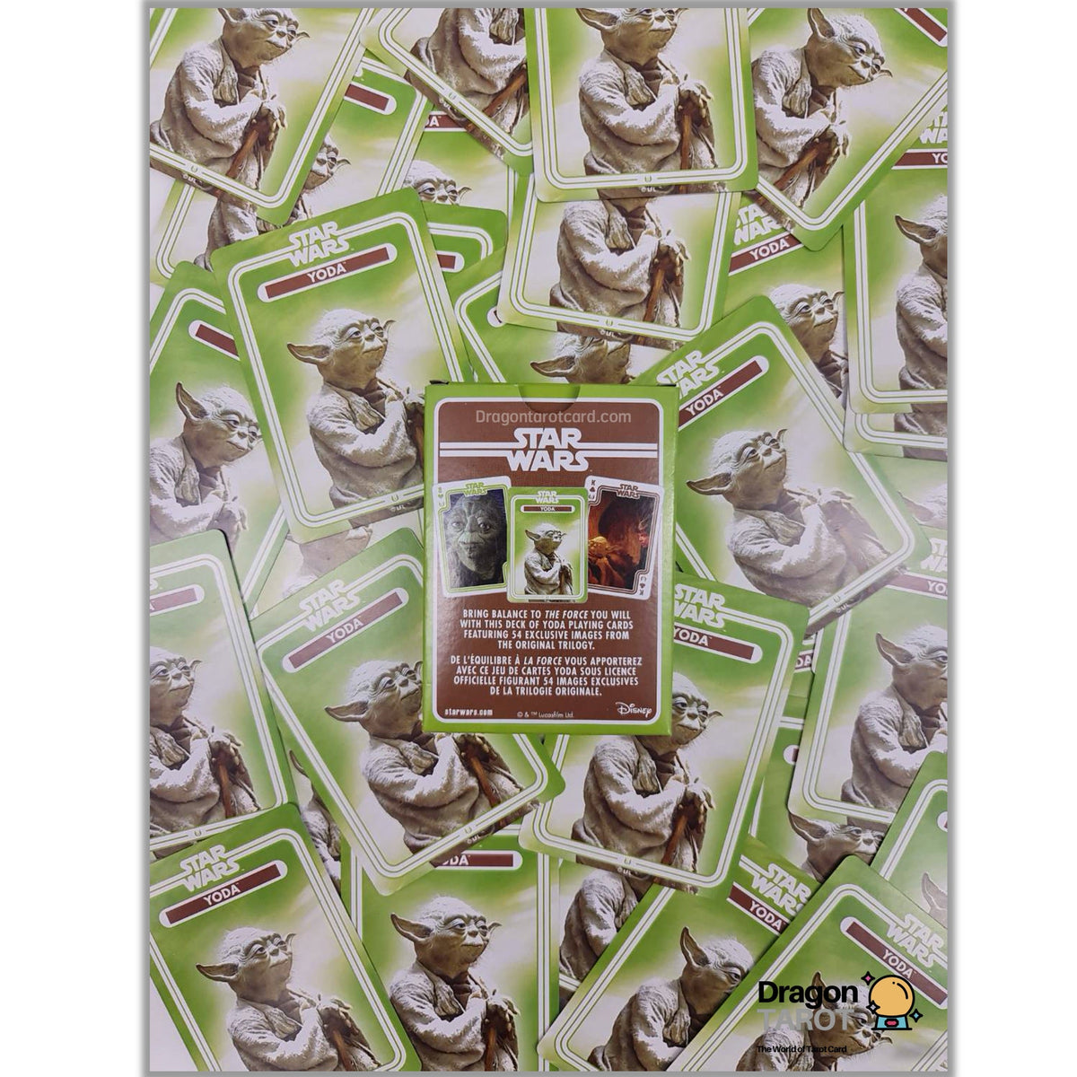 Star Wars Yoda trading card game board game box shown against a white background, with many sample Yoda cards scattered behind it. The box features green borders and a brown central panel with Star Wars branding.