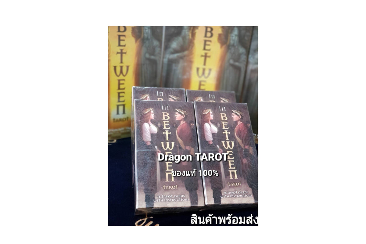 Four boxed tarot card decks titled 'in BETWEEN' stacked on a dark surface, with a larger matching box behind them. The boxes show illustrated figures and the text 'Dragon TAROT' and '100%'.