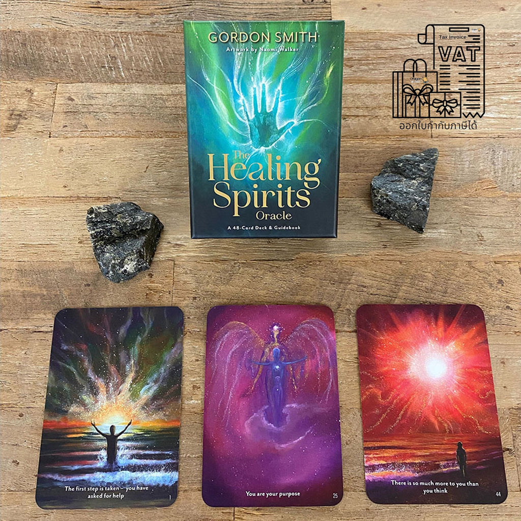 Healing Spirits Oracle card deck box by Gordon Smith displayed on a wooden surface with two dark crystals and three illustrated oracle cards below. The box features a green-to-blue gradient with glowing hands artwork, and the cards show colorful spiritual imagery.
