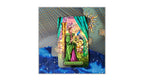 A tarot card deck box or card package featuring a colorful illustrated card with a woman in green and pink robes beside a golden pillar and blue bird, set against a decorative blue and gold patterned background.