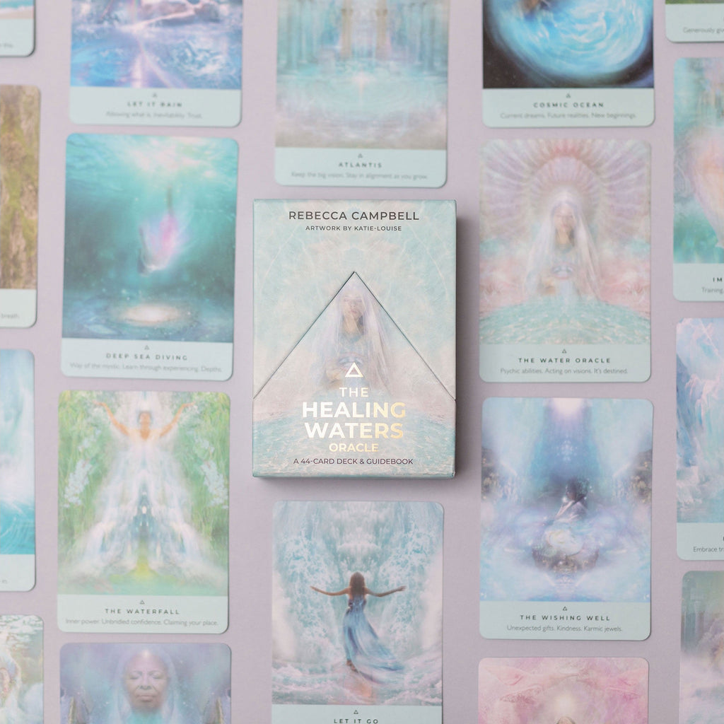 The Healing Waters oracle card deck by Rebecca Campbell, displayed in the center against a background of multiple illustrated cards in soft pastel colors.