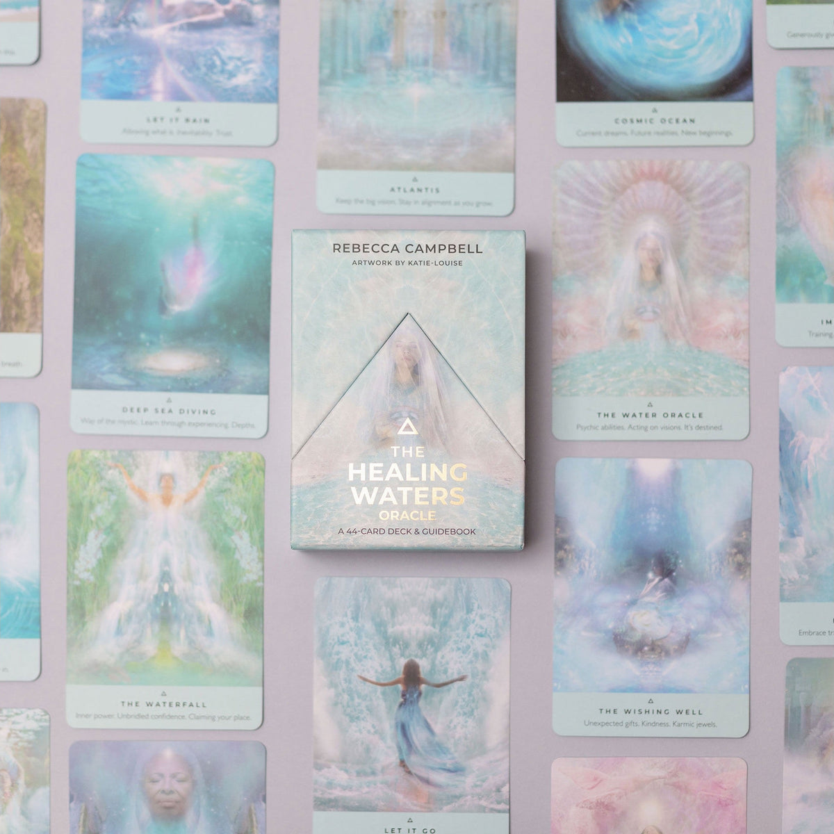 The Healing Waters oracle card deck by Rebecca Campbell, displayed in the center against a background of multiple illustrated cards in soft pastel colors.