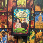 Good Omens Tarot Deck and Guidebook box centered against a background of colorful illustrated tarot cards.