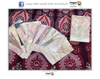 A set of Dragon Tarot cards with a 'Rose' card displayed next to a fanned-out selection of cards on a patterned purple and pink fabric background.