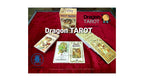 Dragon Tarot deck and boxes displayed on a red velvet cloth, with multiple card packs and boxes arranged on a dark surface. The Dragon Tarot logo and branding are visible on the image.