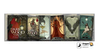 A set of five Dragon Tarot cards displayed side-by-side on a white background with promotional text and logos. The cards feature dark, gothic illustrations including a red-robed figure, a wolf, a cloaked figure, a bird, and a woman under a full moon.
