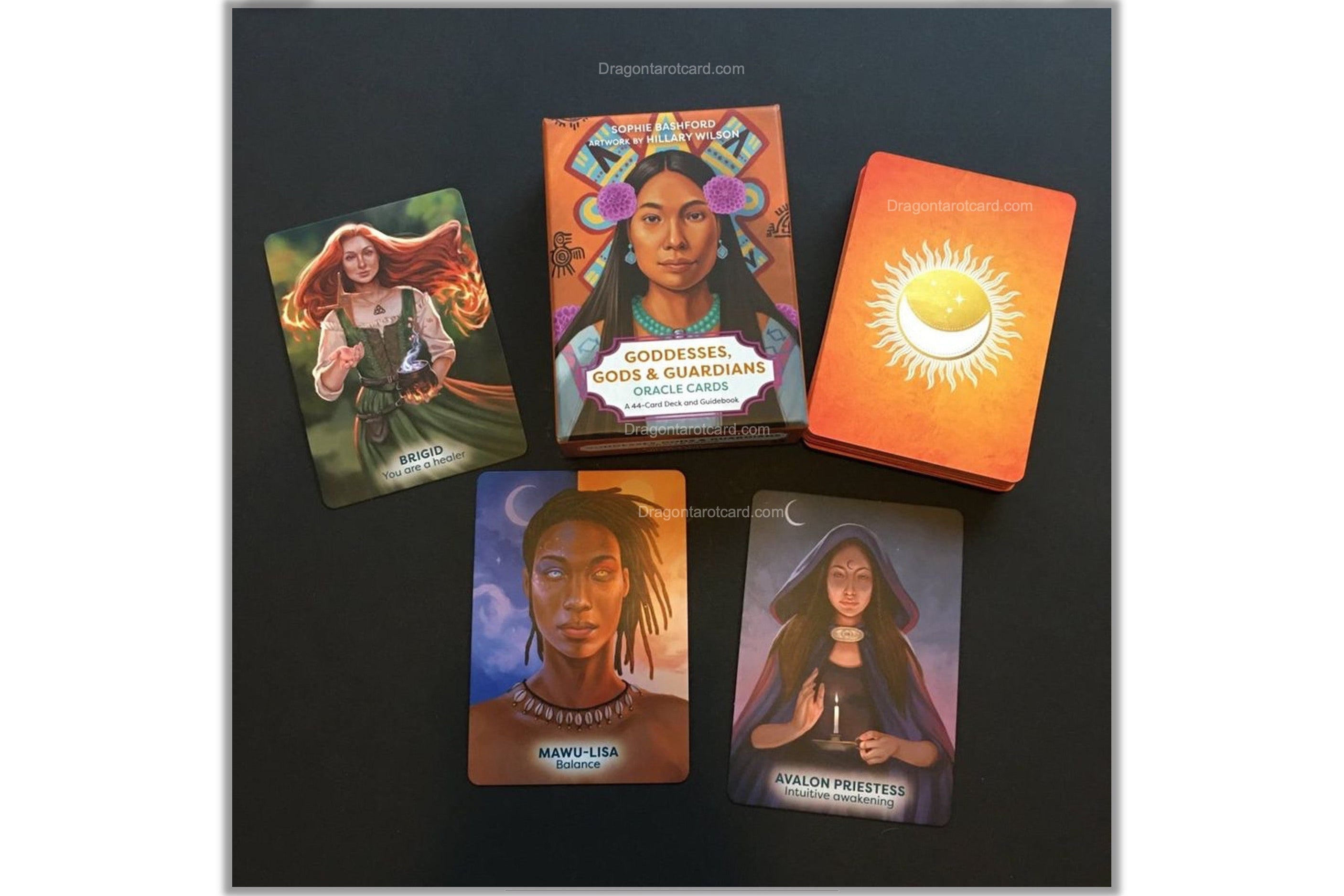 A set of Dragon Tarot oracle cards displayed on a dark background, featuring various illustrated cards and a bright orange card back with a yellow sun design. The brand logo 'Dragon Tarot' is visible at the top and bottom of the frame.